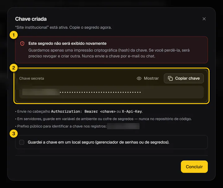 Diálogo Chave criada com o aviso de que o segredo não será exibido novamente, a chave mascarada e os botões Mostrar e Copiar chave.